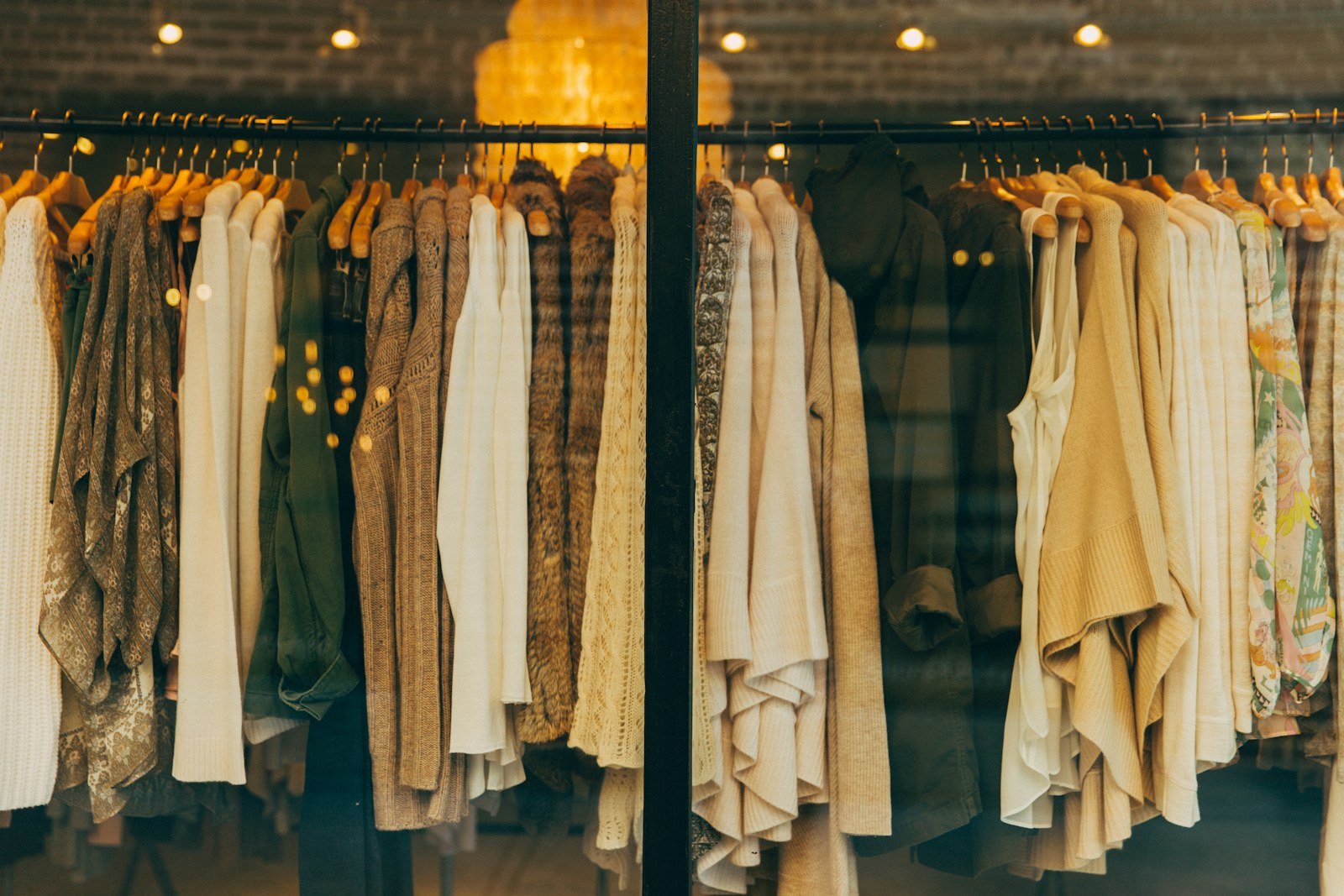 Clothing boutique window with garments on display